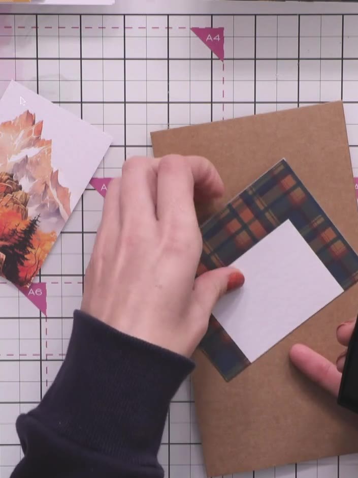 Step 6: Adhere the top and bottom topper sections to your kraft card base using adhesive. Position the tartan-bordered