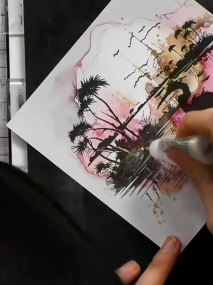 Step 6: Apply glitter glue randomly across the water area of the card to create a sparkling, reflective quality to the