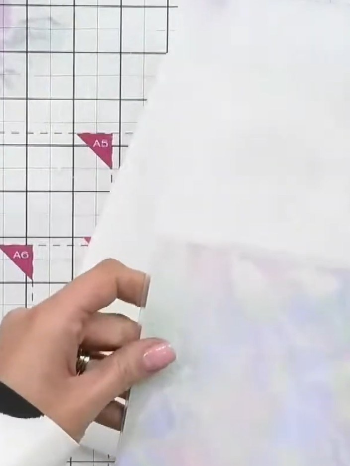 Step 1: Place your holographic-effect cardstock into the 3D embossing folder with the Eternity floral design. Run it t