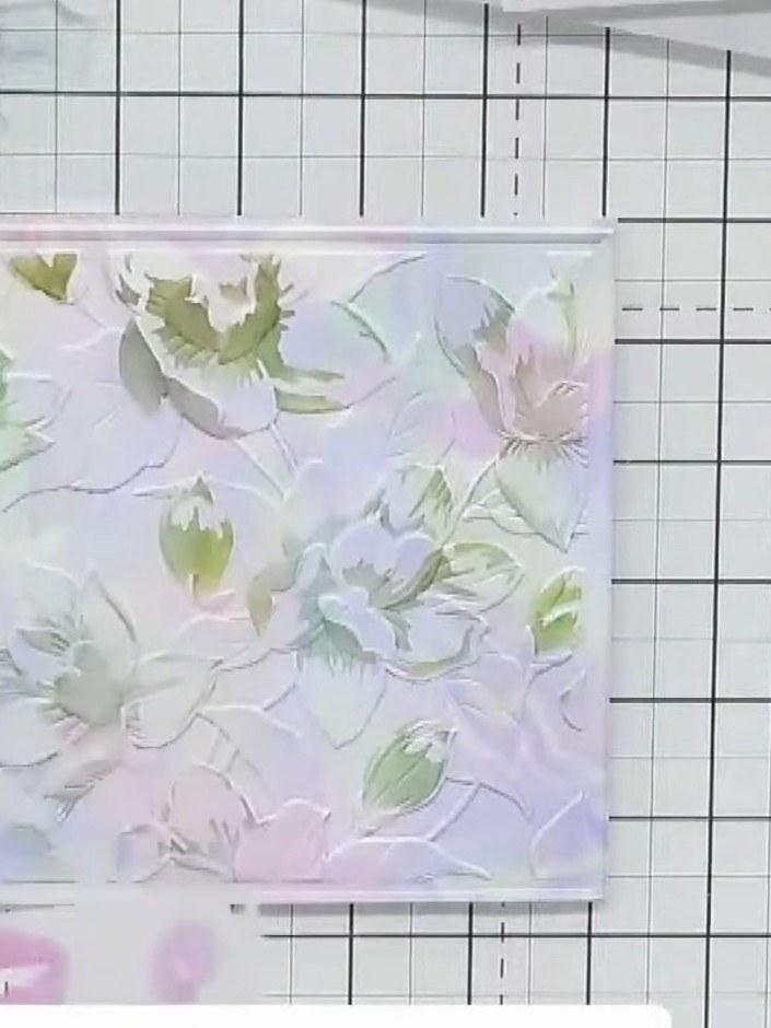 Step 5: Place the leaf stencil over your embossed design. Apply green ink through the stencil using a blending tool to