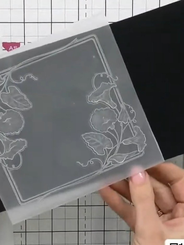 Step 1: Place your white cardstock centrally into the embossing folder with the sweet pea design. Position it carefull