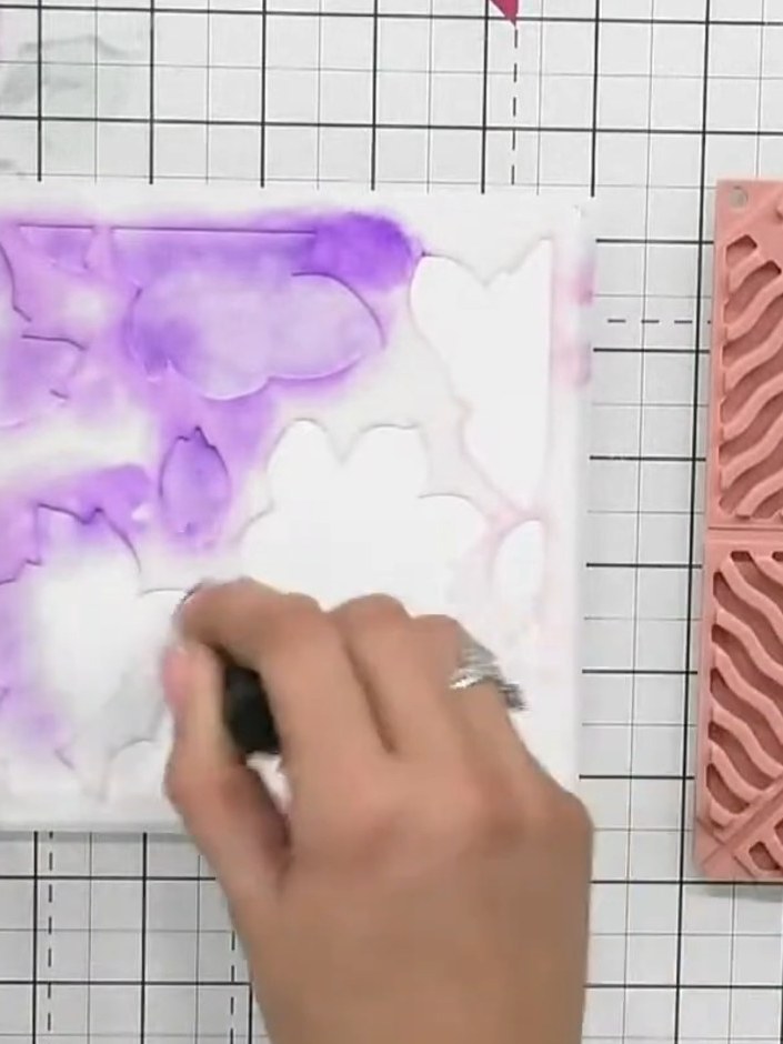 Step 2: Apply a second layer of purple ink over the same areas where you applied the first layer, building up depth an