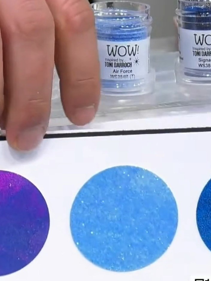 Step 6: Tap off excess embossing powder from the stamped image. The powder should only remain on the stamped areas whe