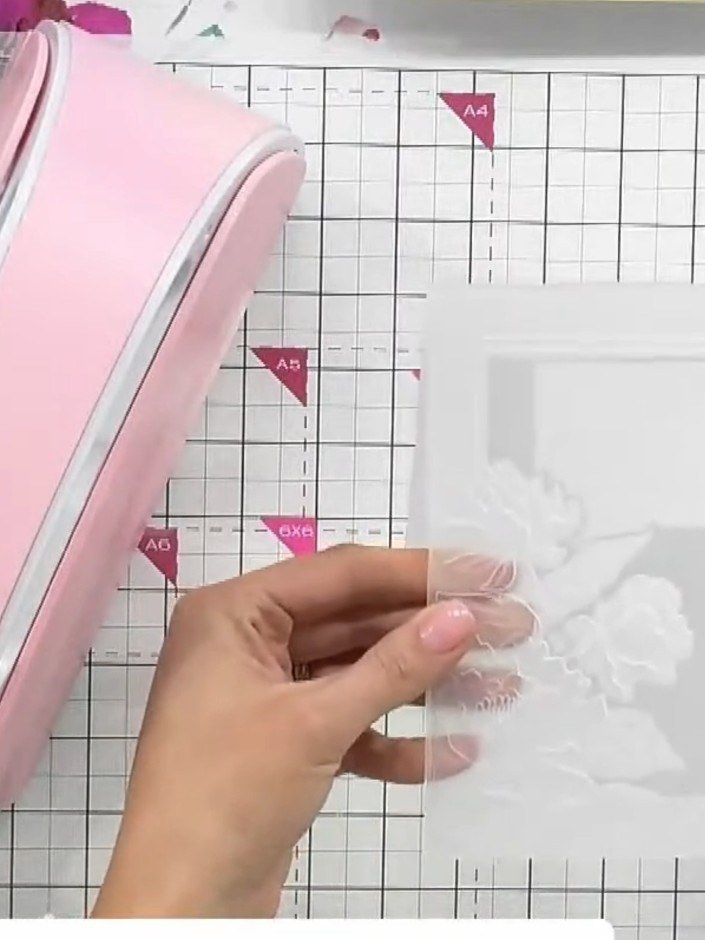 Step 1: Place the white cardstock with the die positioned at the front of the embossing folder. The die should be wher