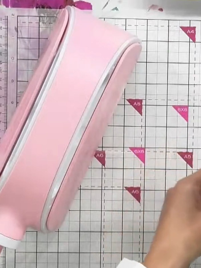 Step 3: Remove the embossed and die-cut pink cardstock from the 3D embossing folder to reveal the aperture with the ch