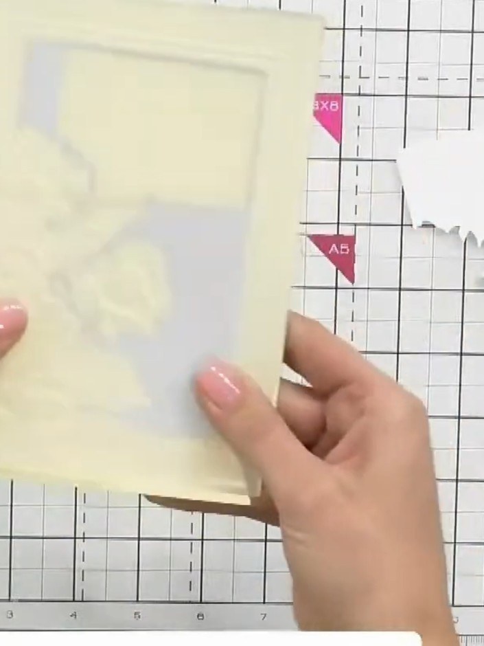 Step 1: Place the gold cardstock into the embossing folder with the die positioned at the front. Run the folder throug