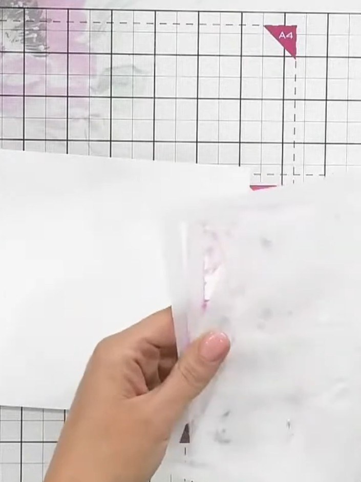 Step 2: Using stencil one and a brush, apply pink ink lightly through the stencil to create the first layer of the mag