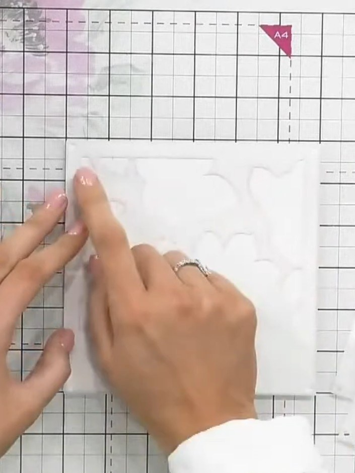 Step 3: Remove the first stencil and position the second numbered stencil. Apply the same pink ink through this stenci