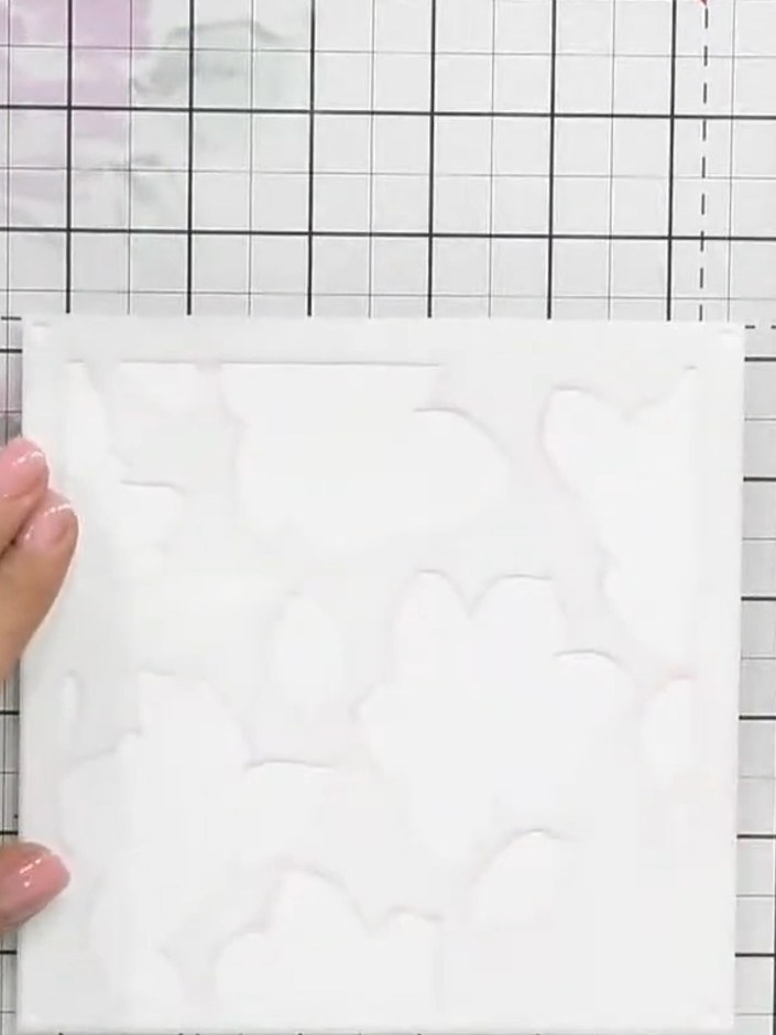 Step 4: Place the Hazel paper from the folder with the apartment design into the embossing folder. Apply light pressur