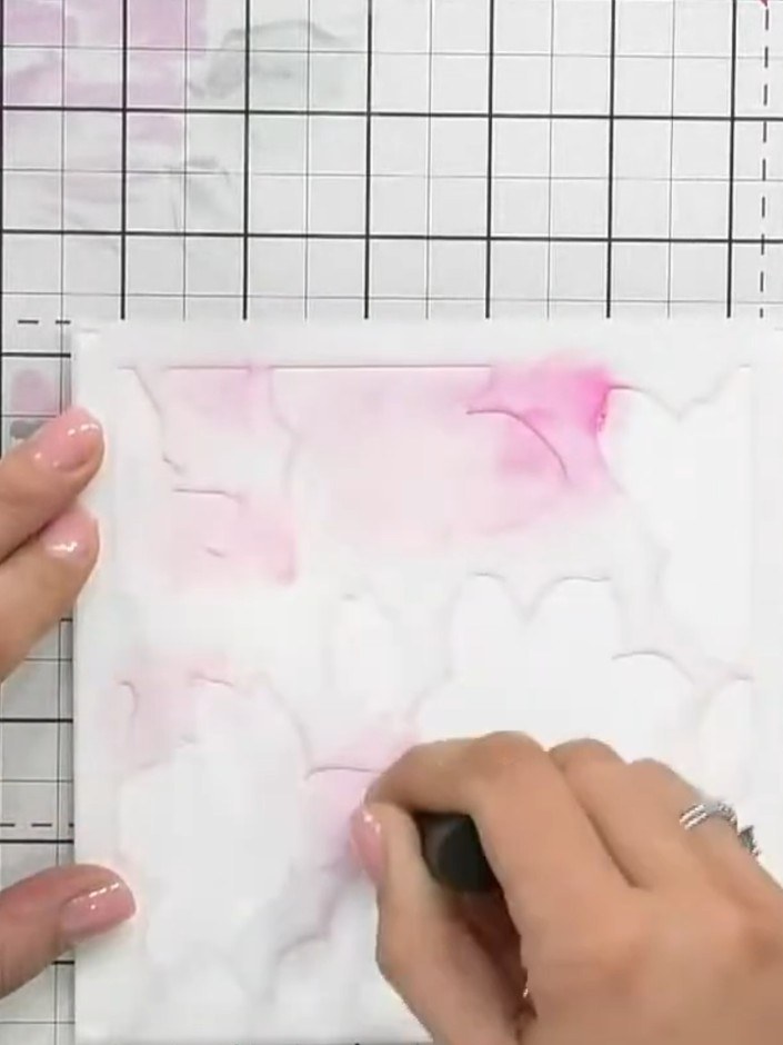 Step 7: Using the green ink pad, stamp the floral image onto your white card panel. Position the stamp carefully to cr