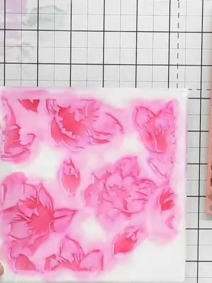Step 9: Run the stamped and embossed card through your die-cutting machine to cut out the individual flower elements f