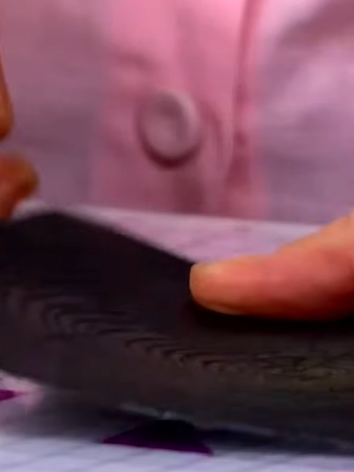Step 4: For a more realistic timber effect, swipe the embossed card with brown ink. Work the ink across the raised tex