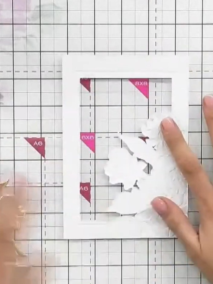 Step 1: Run white cardstock through the embossing folder with the die positioned at the front to create the embossed d