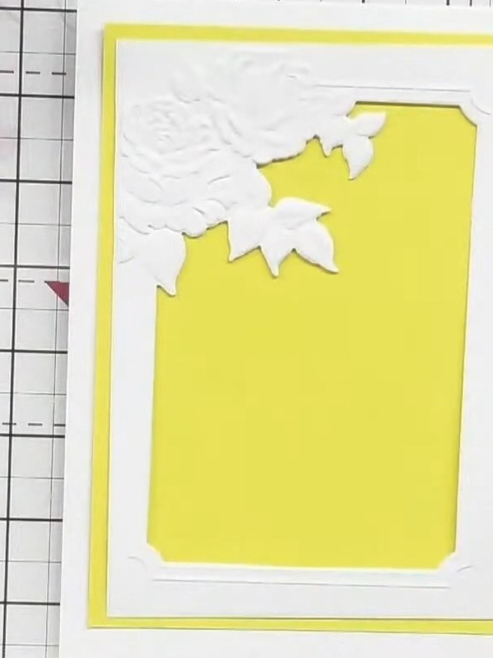Step 2: Remove the embossed and cut piece from the yellow cardstock to reveal the embossed frame with the butterfly ap