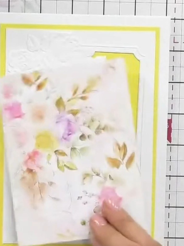 Step 6: Adhere the complete embossed frame piece with the floral design onto your yellow card base using foam pads for