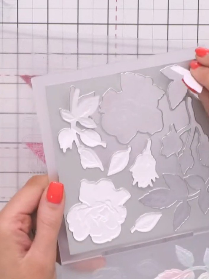 Step 2: Carefully remove the die-cut pieces from the embossing folder by gently peeling away the tape to access the in