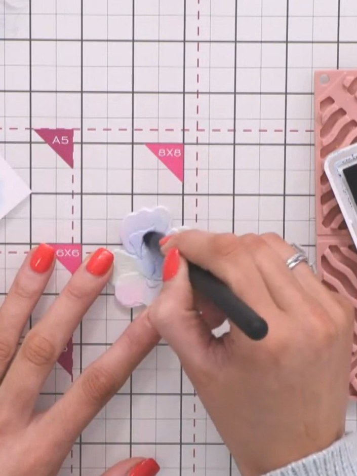 Step 5: Add pink ink to the centre of the flower whilst the paper is still wet, allowing the colours to blend naturall