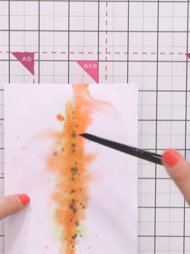 Step 9: Add teal splashes to the background using a pen or brush to create small dots and marks. This ties in with the