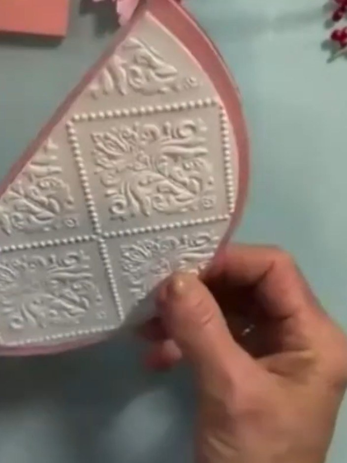 Step 11: Cut two circles using round dies (approximately 7 inches diameter). Fold each circle in half to create the car