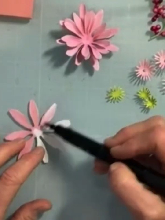 Step 2: Colour both the front and back of all four petal pieces with pink alcohol ink, working from the inside outward