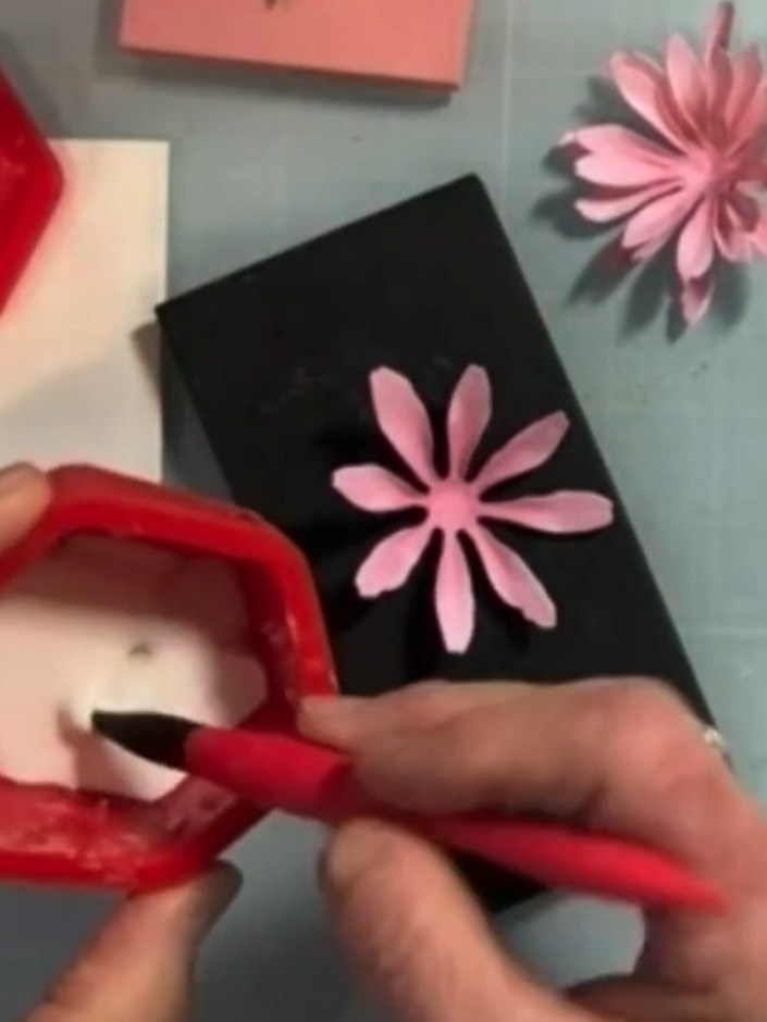 Step 5: Use a medium ball stylus on a molding mat to cup and shape the pink gerbera daisy petals. Work each petal gent