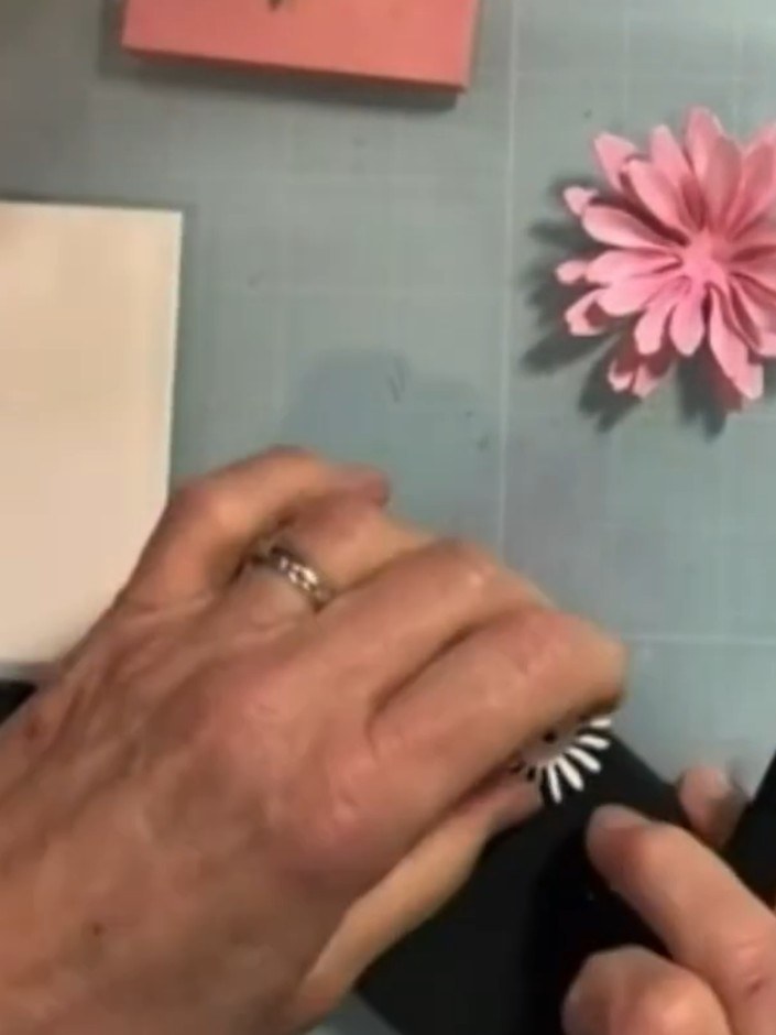Step 7: Take the smaller pink flower centre pieces and cup them using a small ball stylus on your craft mat. Gently wo
