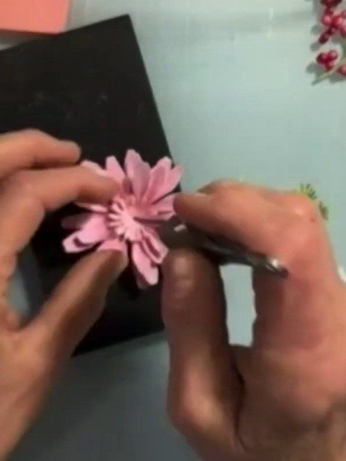 Step 9: Layer the smaller pink flower centre piece on top of the larger one, offsetting the petals slightly to create 