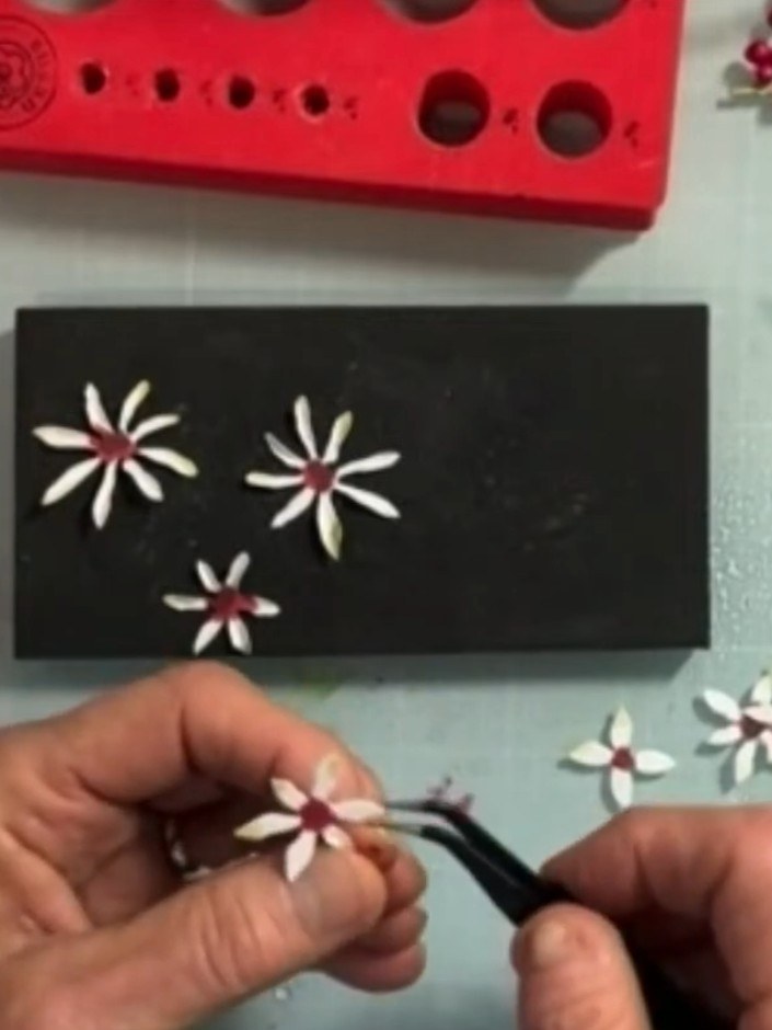 Step 2: Colour the front and back of all petal pieces with deep red alcohol ink. Work on a black mat to catch any exce