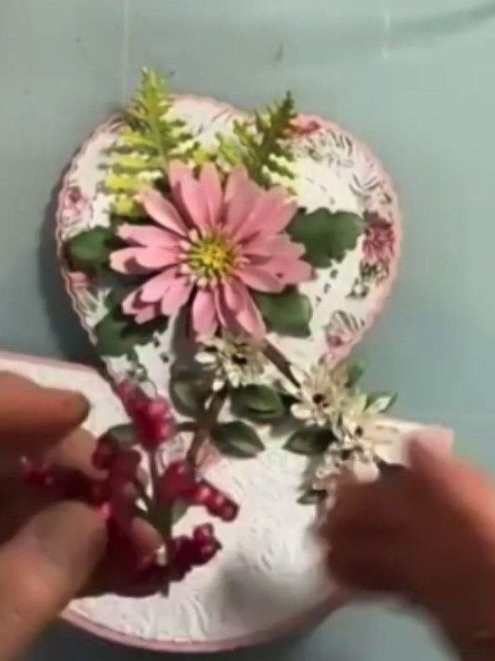 Step 8: Layer the medium-sized petals on top of the large petals, then add the small petals on top, offsetting each la