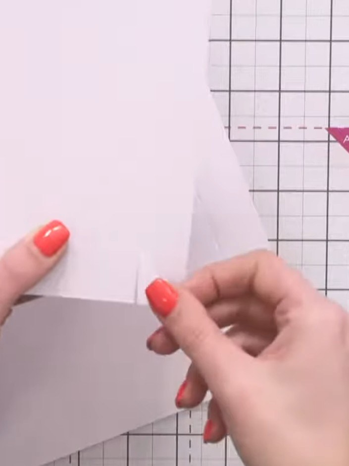 Step 3: Score the smaller piece of card 1 inch in from all four edges to create fold lines. Use a scoring tool and rul