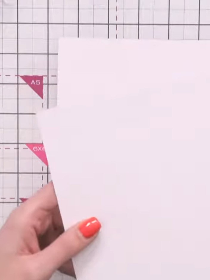 Step 4: Score the larger piece of card 1 inch (2.5 cm) in from all four edges using your scoring board and bone folder
