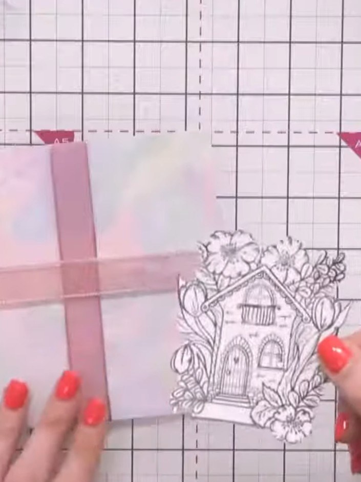 Step 1: Fussy cut the house and flower design from the stamped sheet. Keep the oversized elements for visual impact on