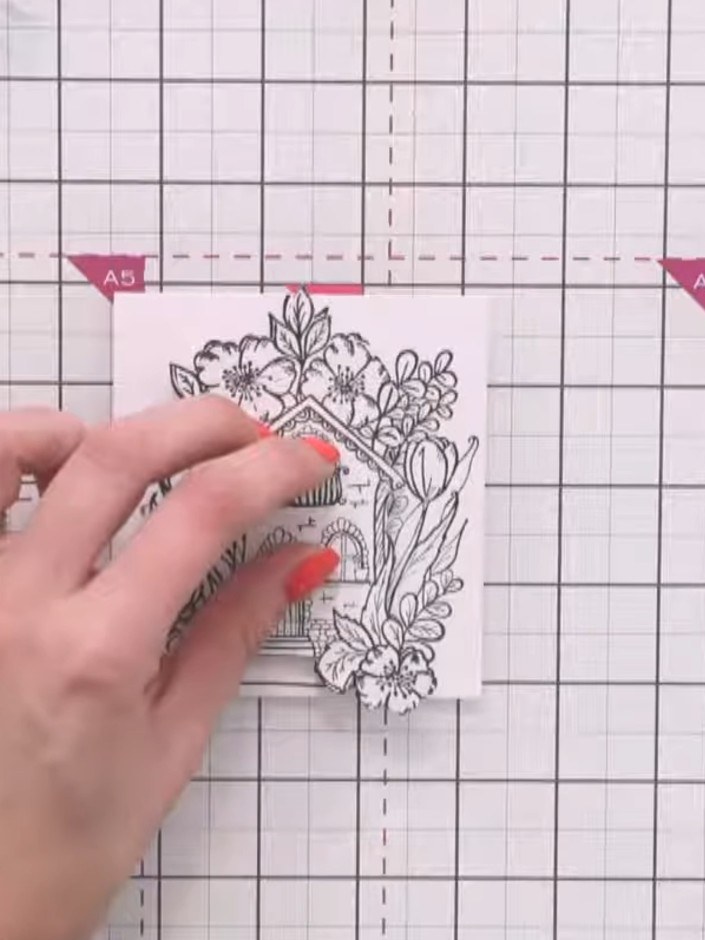 Step 6: Stamp additional elements onto a fourth sheet of white cardstock using the house and floral stamps. Carefully 