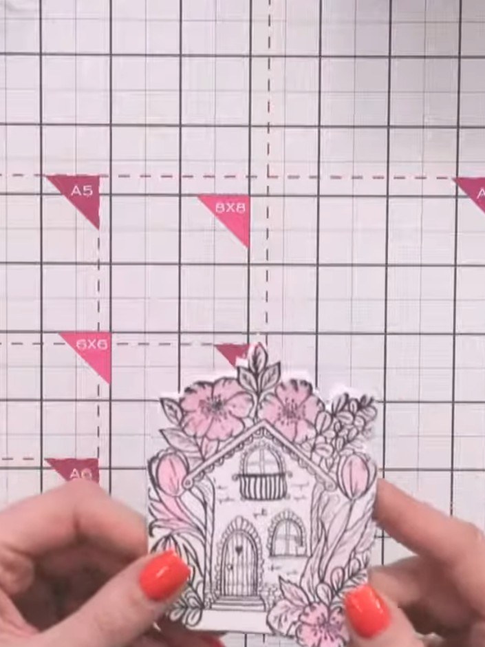 Step 4: Colour the fussy-cut floral house design using your choice of colouring medium such as ink pads, coloured penc