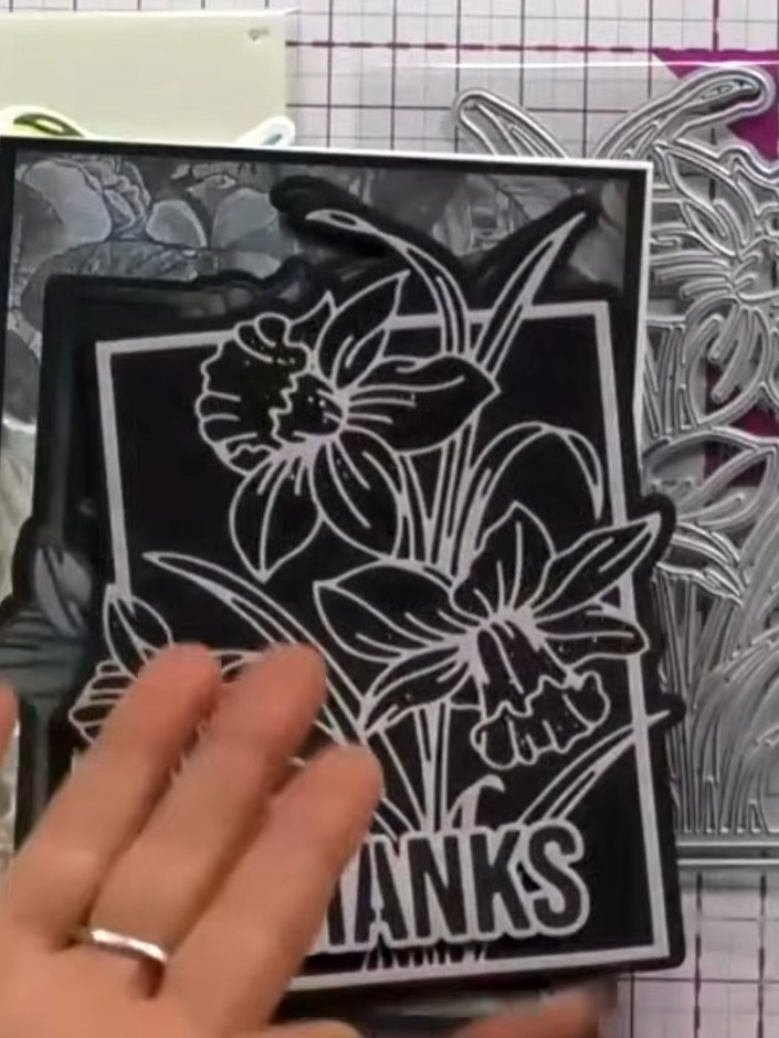 Step 3: Use the large daffodil die to cut out the coloured and stenciled image. Position the die over the completed st