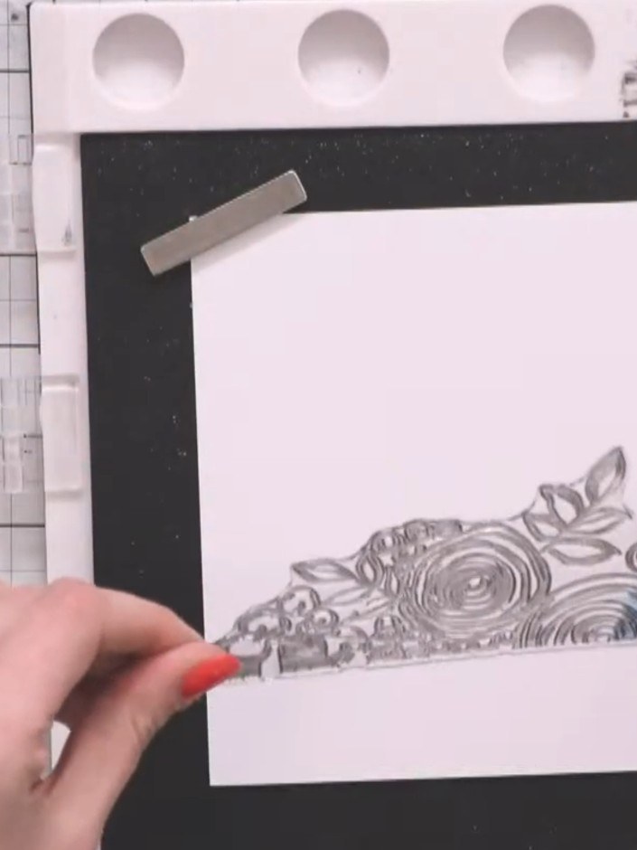 Step 2: Stamp the floral border image from the Happy Home stamp set onto the smallest white card piece using a sticky 
