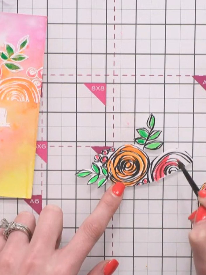 Step 5: Use a dry brush technique to add texture to the die-cut flowers. Drag the brush across the surface of selected