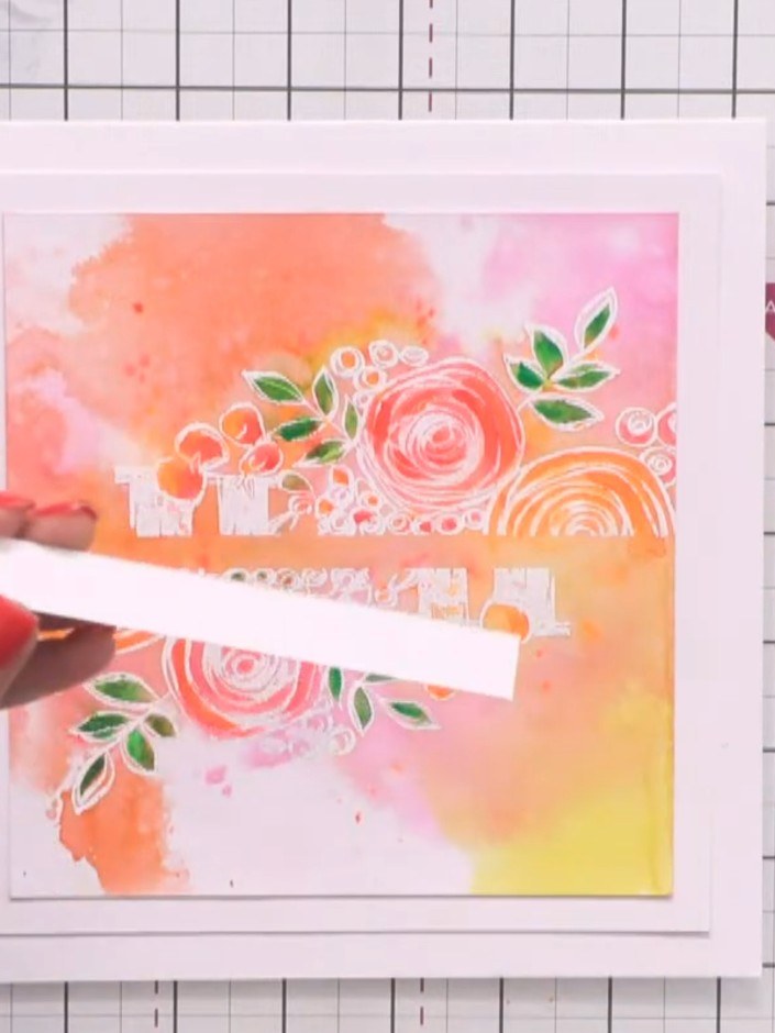Step 5: Position your white sentiment banner strip horizontally across the centre of the watercolour panel to create a