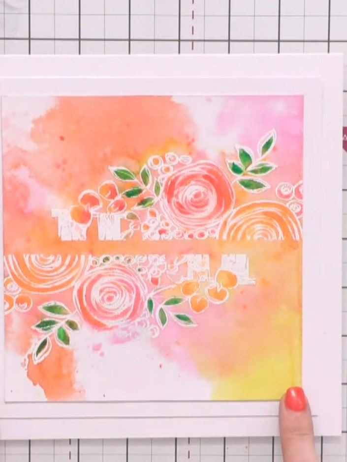 Step 6: Apply adhesive to the back of your watercolour floral accent piece and position it on top of the white sentime