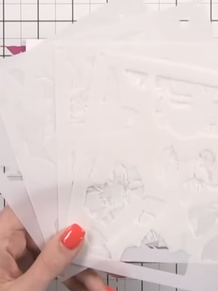 Step 1: Line up the first layering stencil (numbered 1) on your cardstock, positioning it carefully using the corner g