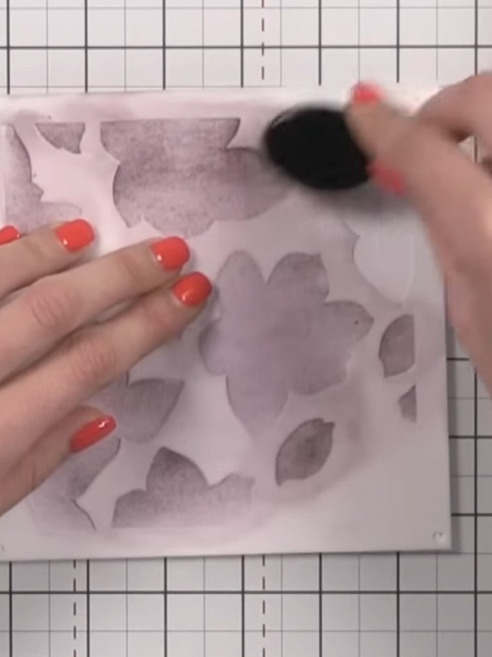 Step 4: Apply Fandango ink through the second stencil layer to build up the floral design. Use a blending tool to dab 