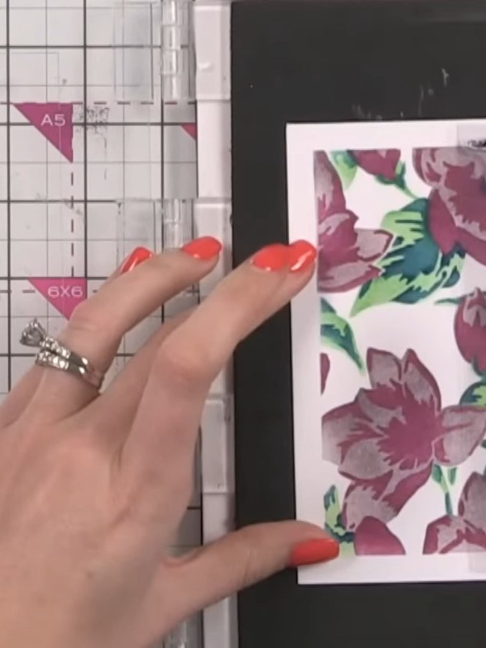 Step 7: Stamp the first part of the two-part stamp onto your inked stencil work using black ink, carefully lining up t