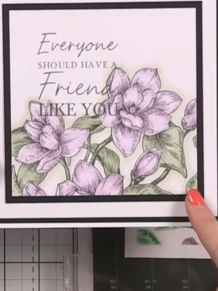 Step 9: Die-cut the stamped and coloured floral panel using the coordinating outline die from the Quattro D Magnolia G