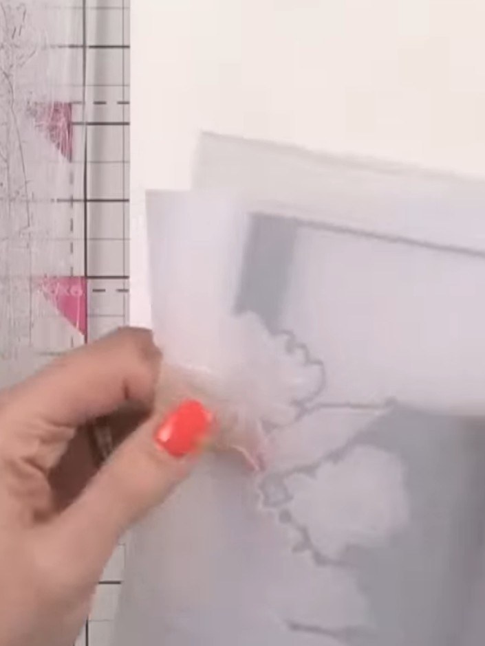 Step 2: Place the cardstock into the Eternity embossing folder with the die facing upwards. Ensure the cardstock is pr