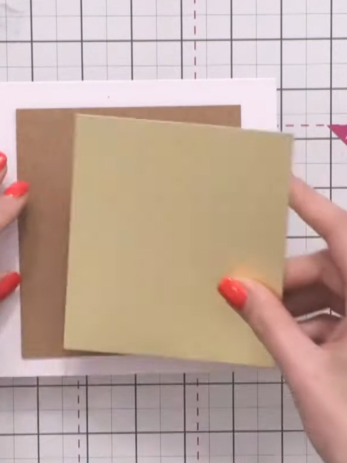 Step 1: Gather your materials: a 6x6 card base, craft card in brown tones, gold card, acetate or vellum, coloured ink 