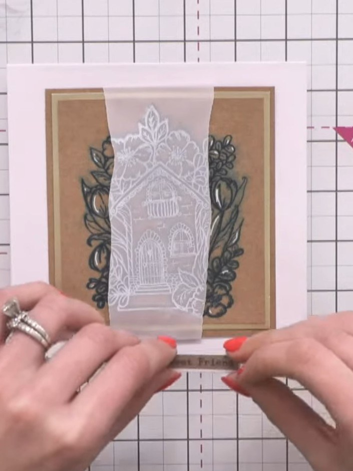 Step 12: Finish the card by adhering a washi tape sentiment strip across the lower portion of the card. Choose a sentim
