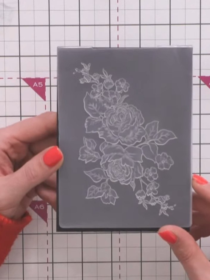Step 2: Apply sticky embossing ink pad to the black cardstock, pressing down firmly to ensure even coverage over the s