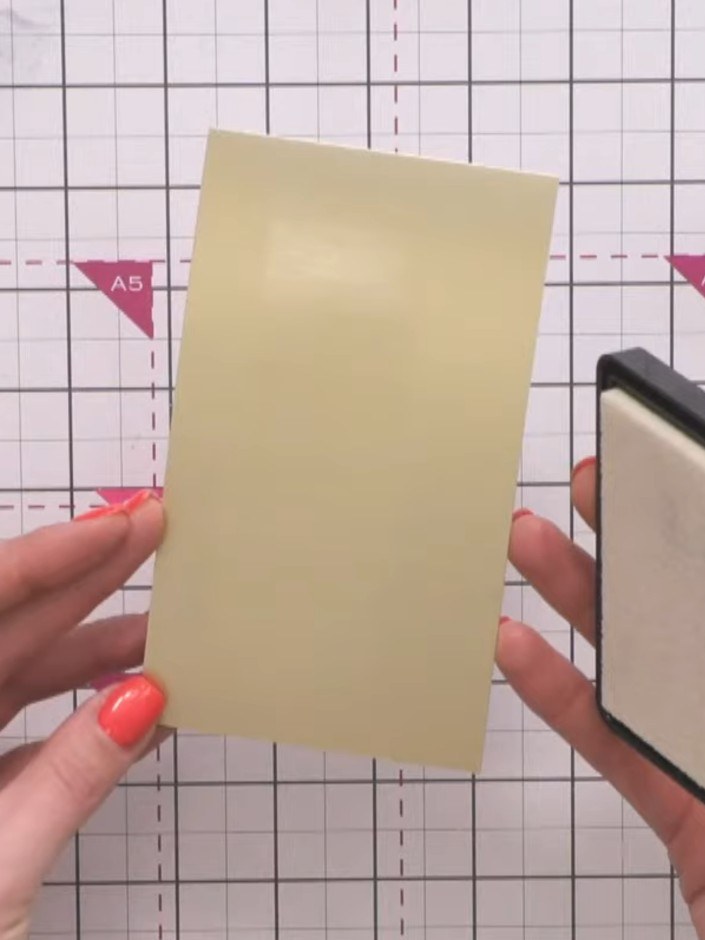 Step 3: Heat set the gold embossing powder using a heat gun, moving it over the surface until the powder melts and bec