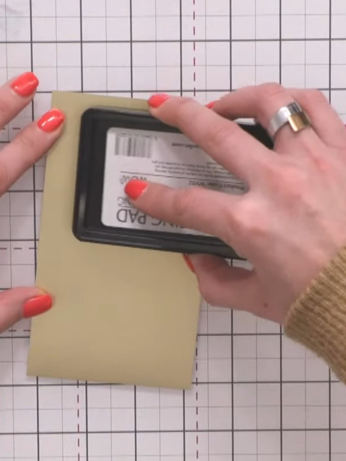 Step 4: Allow the embossed panel to cool completely. Apply sticky embossing ink over the same embossed area of the gol
