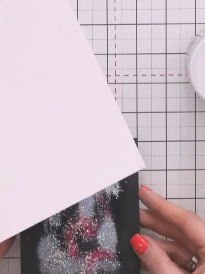 Step 11: Turn the cardstock over and heat set from underneath using a heat tool. This helps to set the embossing powder